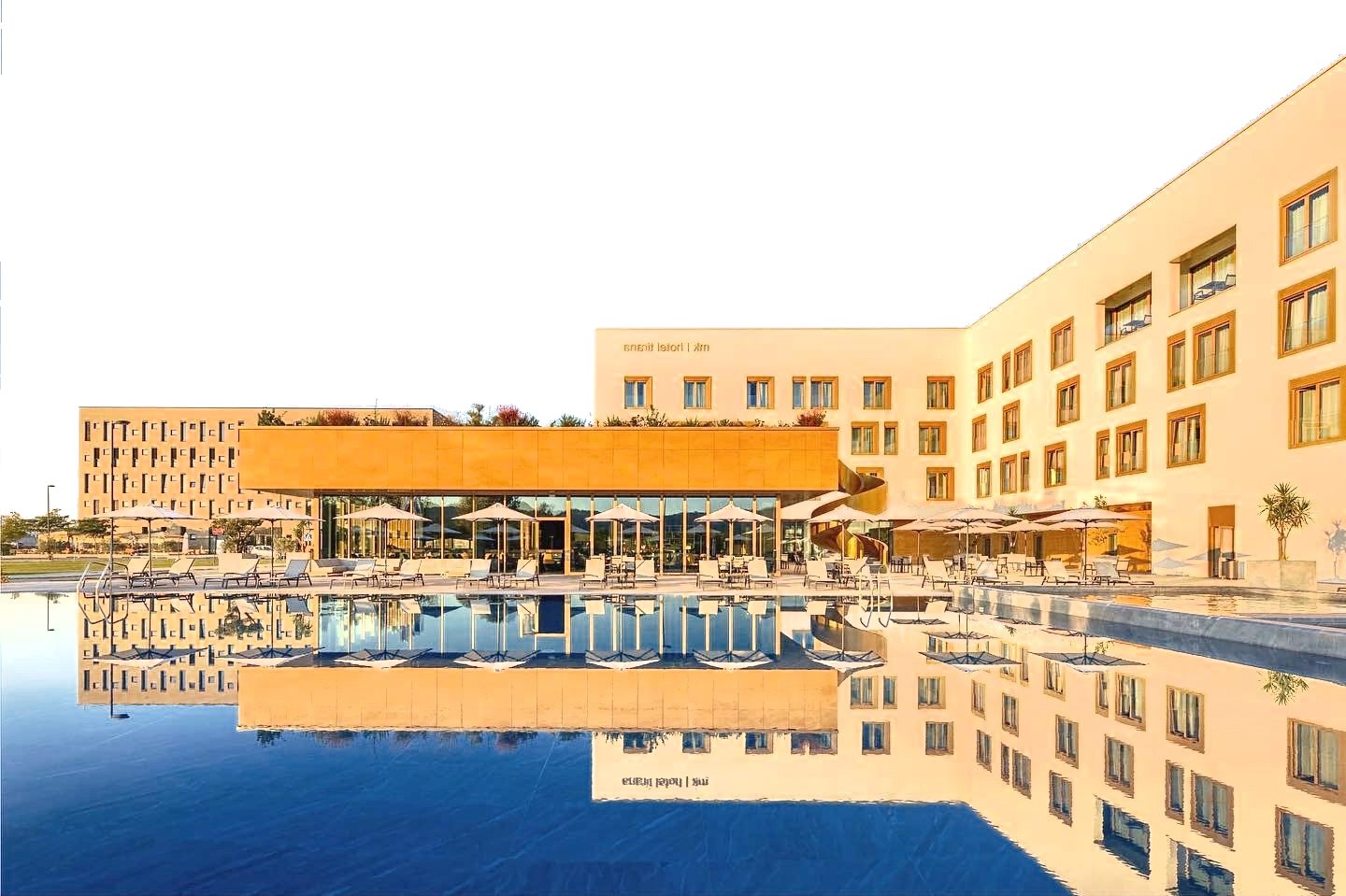mk hotels Tirana — pool and hotel exterior at golden hour